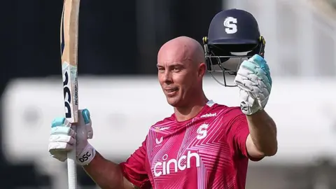 Northamptonshire batter Chris Lynn raises his bat and helmet as he celebrates scoring a century against Warwickshire, at Edgbaston on Sunday 31 May 2026