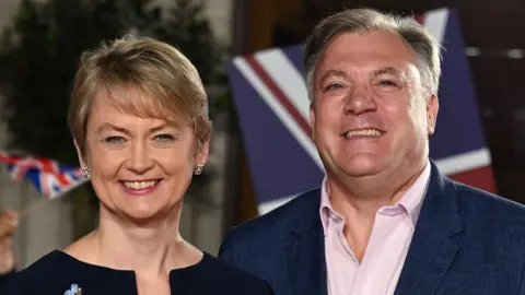 Getty Images Yvette Cooper and Ed Balls standing smiling together on the red carpet at the Pride of Britain Awards 2022