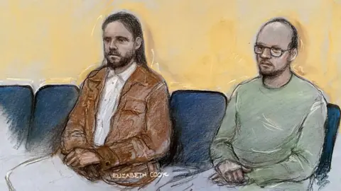 PA/Elizabeth Cook A court sketch of Jamie Varley, 37, wearing a white shirt and brown jacket with long hair and his partner John McGowan-Fazakerley, 32, wearing a green long sleeve t-shirt or jumper with bald head and glasses