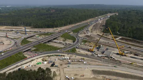 PA Media An aerial view of the M25/A3 junction, showing roadworks being carried out and traffic being diverted off the carriageways.