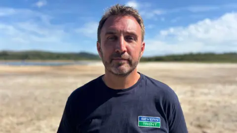 Matt Lewis from Severn Trent Water is pictured wearing a t-shirt with the Severn Trent logo on