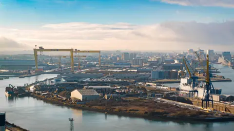 View of Belfast Harbour. The H&W cranes are to the left, along with building and industrial estates.