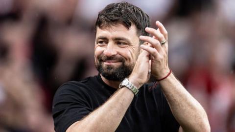 Southampton's manager Russell Martin applauds his side's travelling supporters at the end of the Championship play-off final