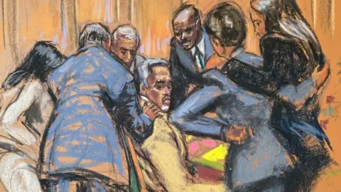 A court sketch of defence lawyers huddling around Sean "Diddy" Combs