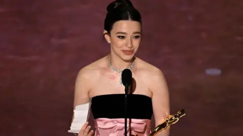 Getty Images US actress Mikey Madison accepts the award for Best Actress in a Leading Role for "Anora" onstage during the 97th Annual Academy Awards at the Dolby Theatre in Hollywood, California on March 2, 2025. (Photo by Patrick T. Fallon / AFP) (Photo by PATRICK T. FALLON/AFP via Getty Images)
