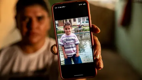 BBC Gelvana shows a photograph  of her lad   Thiago connected  her mobile phone