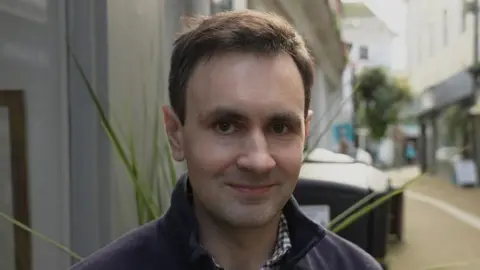 Head and shoulders image of Conservative councillor Nick Craker