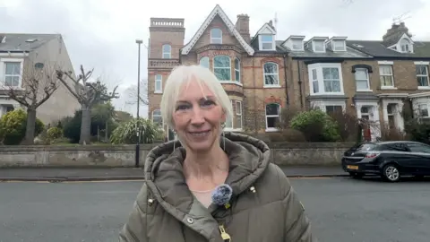 Sue Taylor outside her home in Hornsea