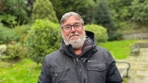 BBC Deputy Peter Roffey smiling at the camera