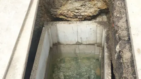 supplied A flooded grave