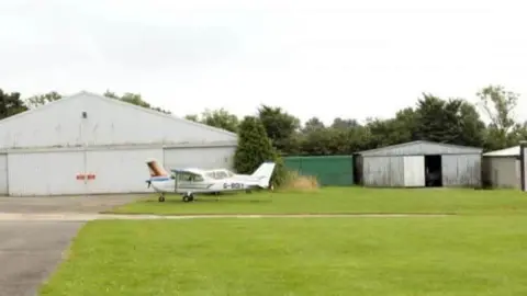 Plane on small airfield