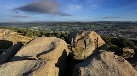 Otley Chevin, a moorland beauty spot. This is the view from the top of the rocks looking out over fields and the town of Otley.