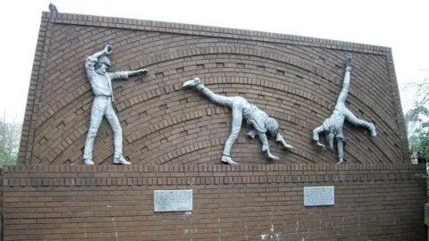 Brian Farmer A picture of the Cartwheeling Boys in Reading leaning against a wall. The picture was taken in 2009.