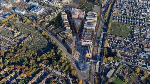 Brookgate Land Ltd Aerial view of the development, showing a triangular shape of apartment buildings. To the left of the development is the busway and the railway station is to the right.