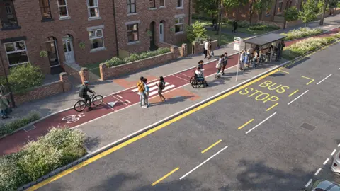 DfT A bus stop (top right) next to the road and a pedestrian crossing to the left which goes across a cycle lane behind the bus stop
