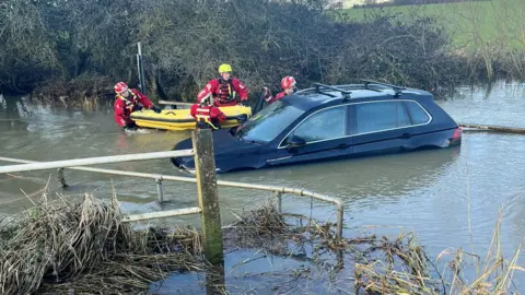 Essex County Fire & Rescue Service A car flooded at Buttsbury Wash near Billericay in Essex