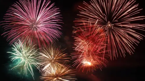 Getty Images A number of large fireworks explosions in different colours