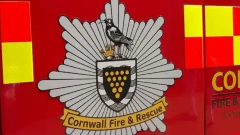 The side of a Cornwall Fire and Rescue Service vehicle.