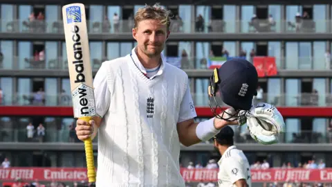 Joe Root celebrates a century against India