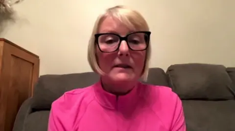 Julie Morton sitting on a sofa