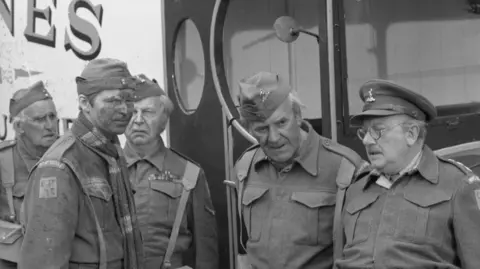 The cast of Dad's Army with Jones's van