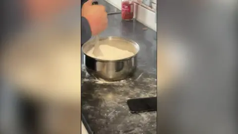Gloucestershire Police An image of a man mixing cocaine in a saucepan