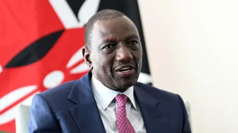 Getty Images President of Kenya William Ruto talks with British Prime Minister Keir Starmer during a Bi-Lateral meeting at United Nations on September 25, 2024 in New York, New York. He is wearing a dark blue jacket and a pink and blue tie with a white shirt.