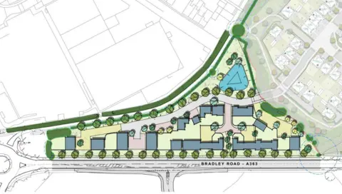 BG Ltd A computer generated aerial map of what the housing development will look like. It is an elongated triangular patch of land, with trees planted around the perimeter and different shaped buildings dotted around the site. At the bottom of the triangle shape is the A363 road.