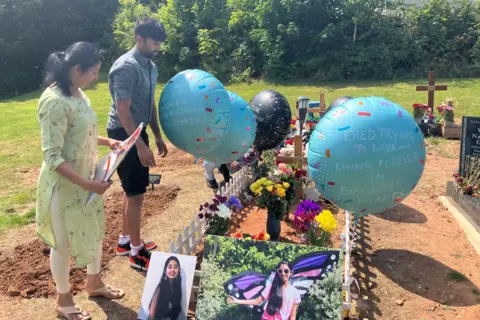 Revathi Malesh Thirumalesh and Varshan Thirumalesh visit Ms Thirumalesh's grave