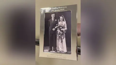 Hambleton Grange Care Home A black and white wedding photograph, in a silver frame.