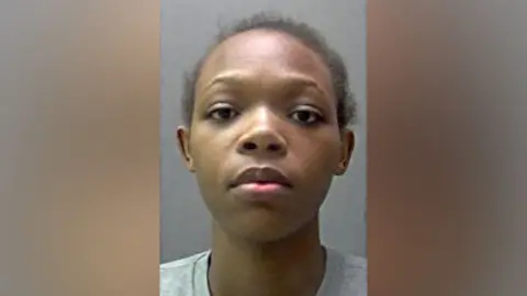Hertfordshire Police A police custody photo of Shilyrand Charigwati - a woman with dark hair wearing a pale grey, round-necked top.