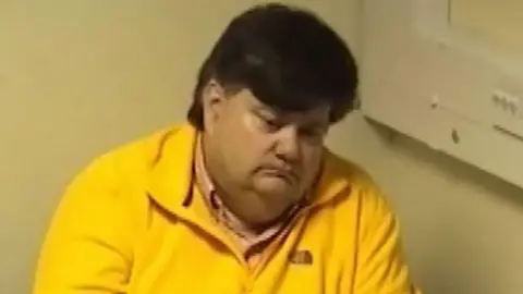 Getty Images Carl Beech. He has short brown hair and is wearing a yellow top.