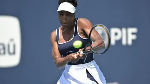 Venus Williams striking a tennis ball