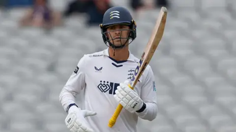Leus du Plooy holds his bat in his left hand and he produced a true captain's innings for Middlesex as he struck 101 not out