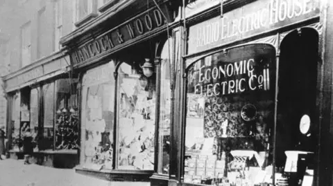 hancock & wood Black and white shot of the front of the shop, taken in the 1920s.