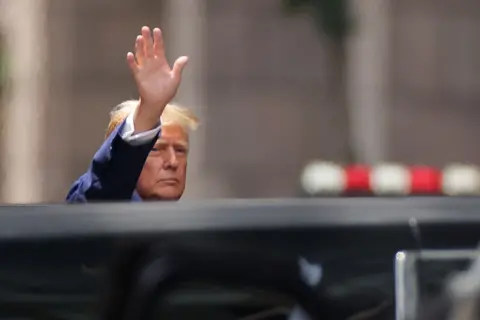 REUTERS/Andrew Kelly Donald Trump waving outside Trump Tower in New York City