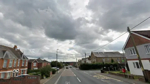 Horsebridge Hill road with houses along both sides.