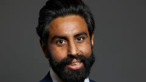 House of Commons/Laurie Noble A man with a beard and moustache