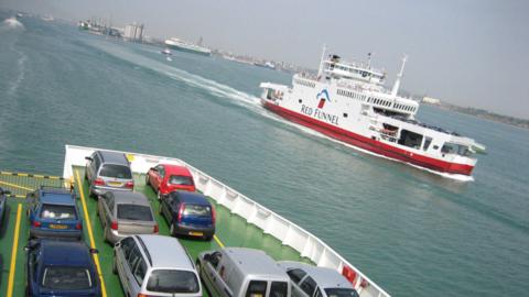A Red Funnel ferry sailing into Southampton, as seen from the car deck of another ferry