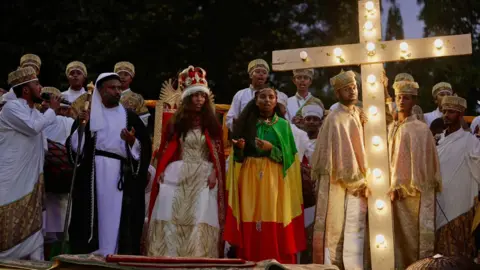 Amensisa Negera / BBC Sunday school students act out a religious scene to mark the Ethiopian Orthodox holiday of Meskel, in Addis Ababa, on September 26, 2024. 