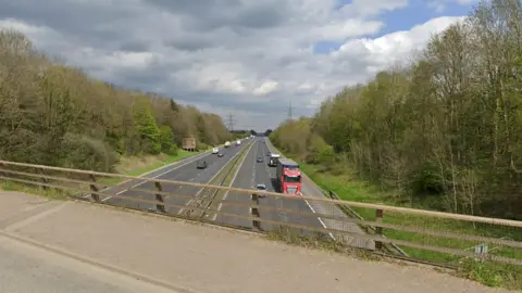 An eight-lane motorway seen from above 
