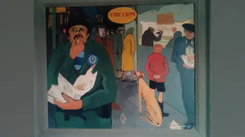 Helen Clay Fish and Chips by Tom McGuinness. It shows people queuing outside a fish and chip shop. A boy is waiting outside with a greyhound, while a man to his right is eating from a newspaper wrapper. To the left a man is eating fish and chips from a newspaper wrapper. He is wearing a green coat and has his nose pointed upwards revealing his nostrils.