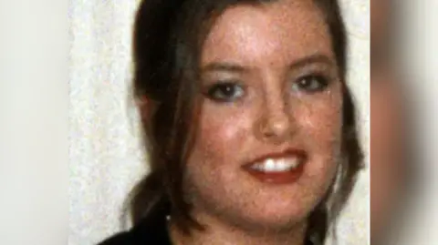 Family Handout Headshot of young woman smiling at the camera