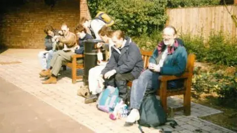 Colin Bell An old photo taken in the 1990s of a group sat on benches having a rest during their march