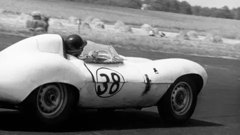 Getty Images Scottish racing legend Jim Clark takes a bend in a car numbered 38 in a black and white picture