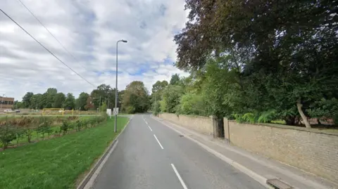 Google street view of Gainsborough Road in Market Rasen. The road is empty and there is a leisure centre on the left, a brick fence and trees on the right and a 30mph watch your speed sign.