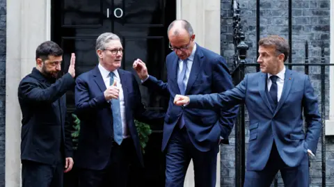 EPA Ukrainian President Volodymyr Zelensky, UK Prime Minister Sir Keir Starmer, French President Emmanuel Macron and German Chancellor Friedrich Merz stand outside 10 Downing Street on Monday, 8 December, 2025