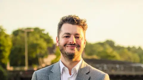 Ipswich Labour Jack Abbott in a grey suit and white shirt