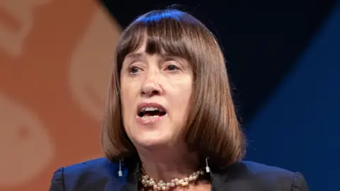 A woman with medium length brown hair, Jane Dodds.