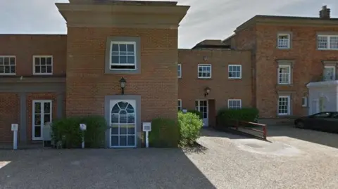 Highfield Park Large brick mansion with white windows